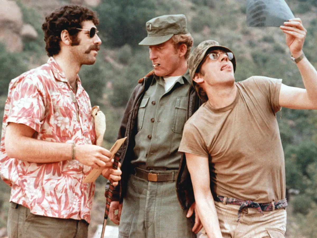 What inspired the creation of the MASH movie, war comedy, Korean War, Robert Altman, Richard Hooker, novel, Hawkeye Pierce, Trapper John McIntyre, black comedy, satire, anti-war sentiment, medical unit, Army, 1970s cinema, dark humor, irreverent, counterculture, social commentary, subversive, irreverent, anarchic, offbeat, ensemble cast, Academy Award-winning, box office success